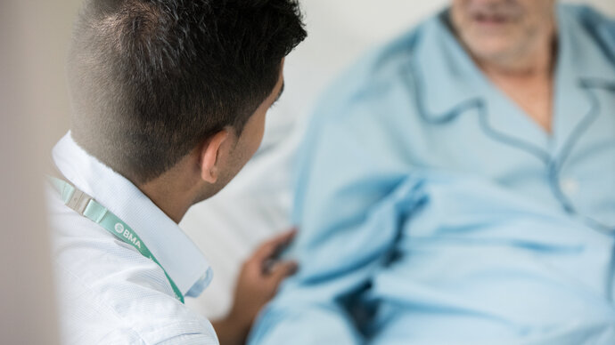 Doctor with an older patient in hospital